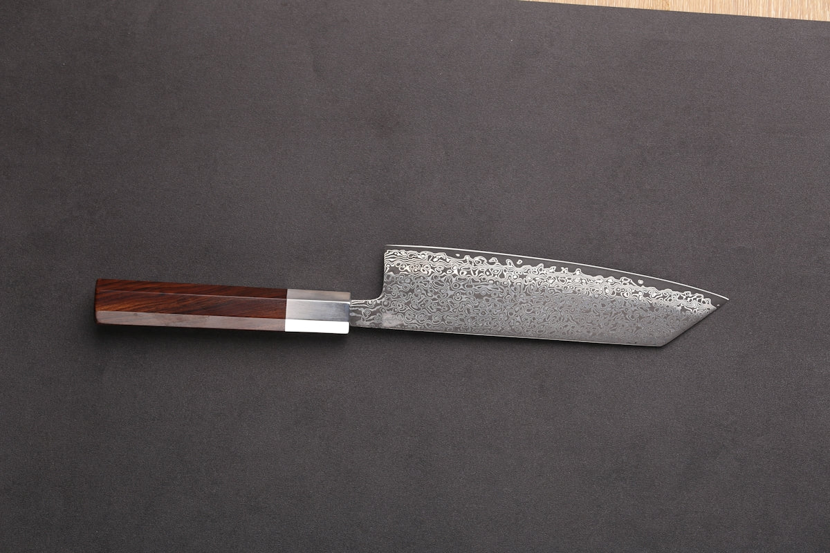 a knife on a cutting board with a wooden handle
