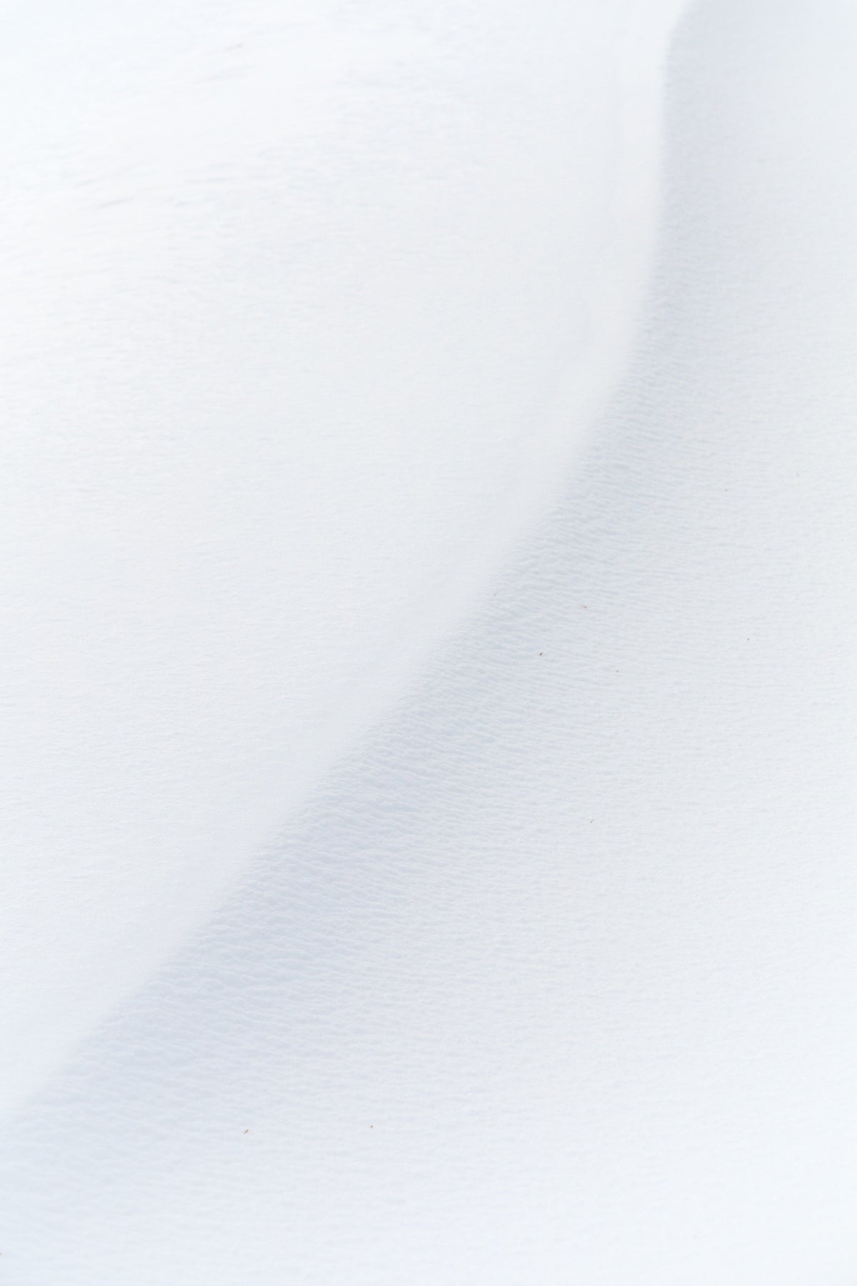 a man riding skis down a snow covered slope