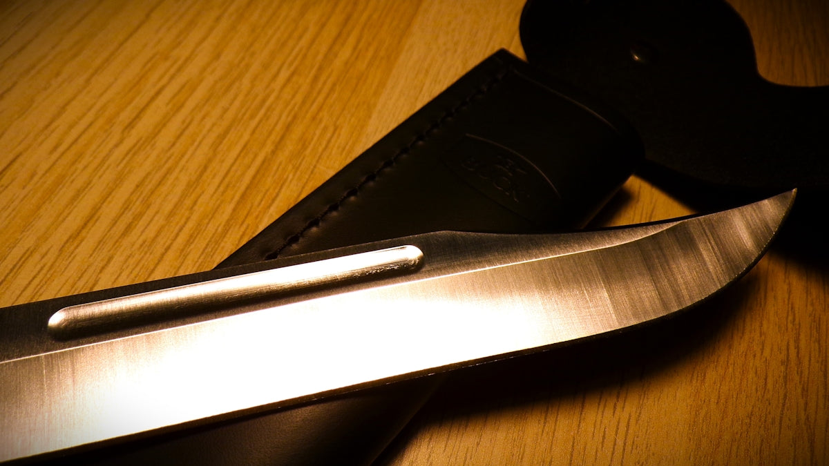 a close up of a knife on a table